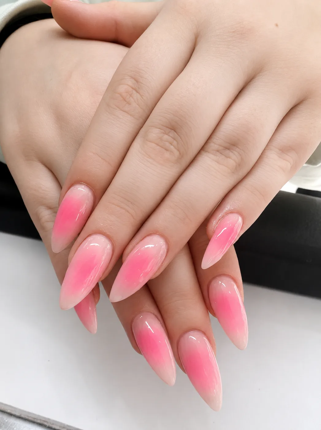 Pink ombr&eacute; almond nails